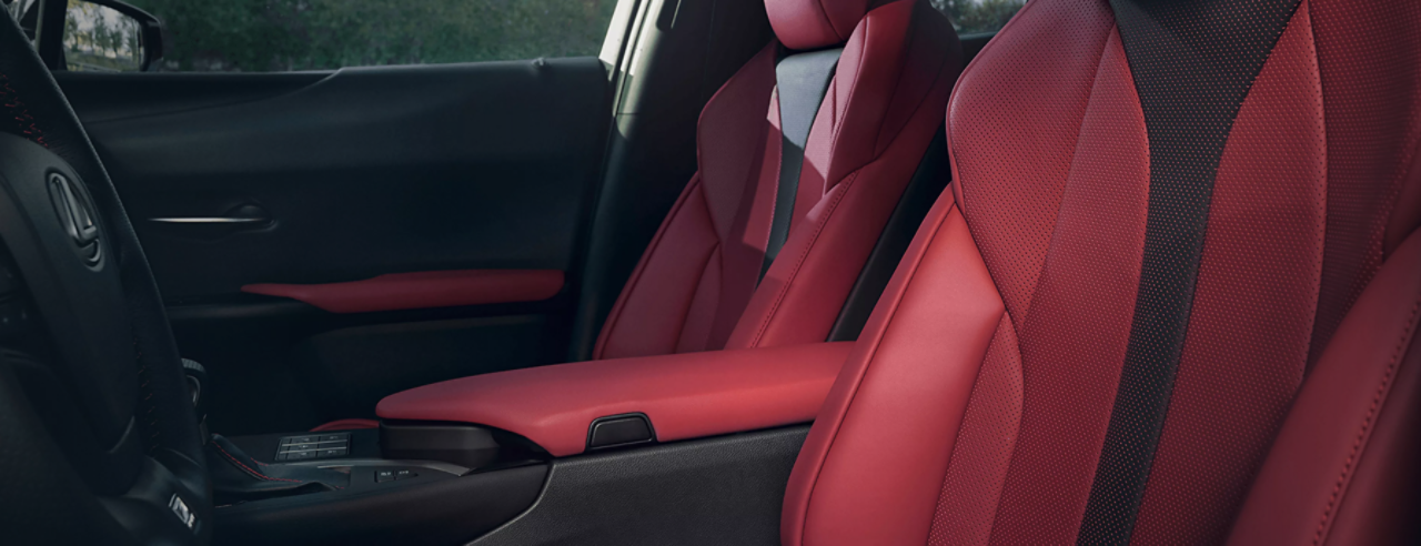 A Lexus UX sleek and modern red interior.
