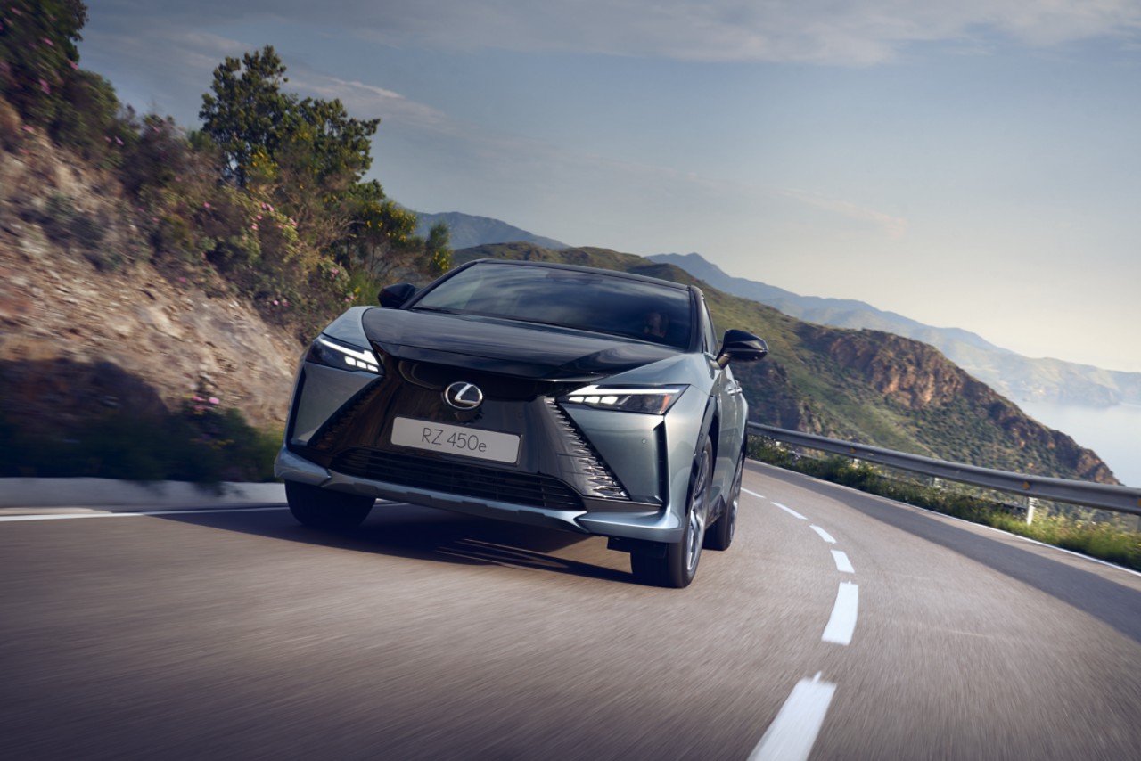 A Lexus UX 300e driving on a road