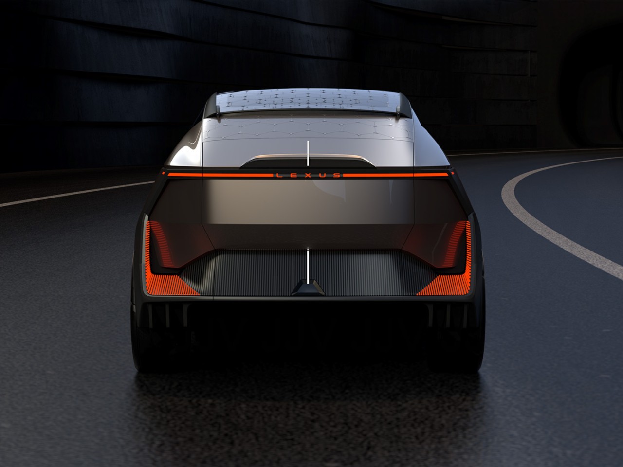 A rear view of the Lexus LF-ZL Concept car driving on a road